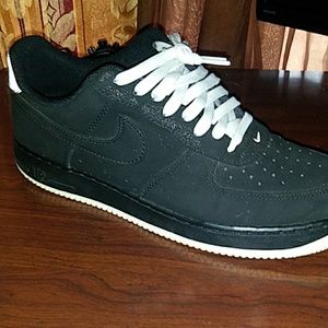 All black leather/suede low top air force ones